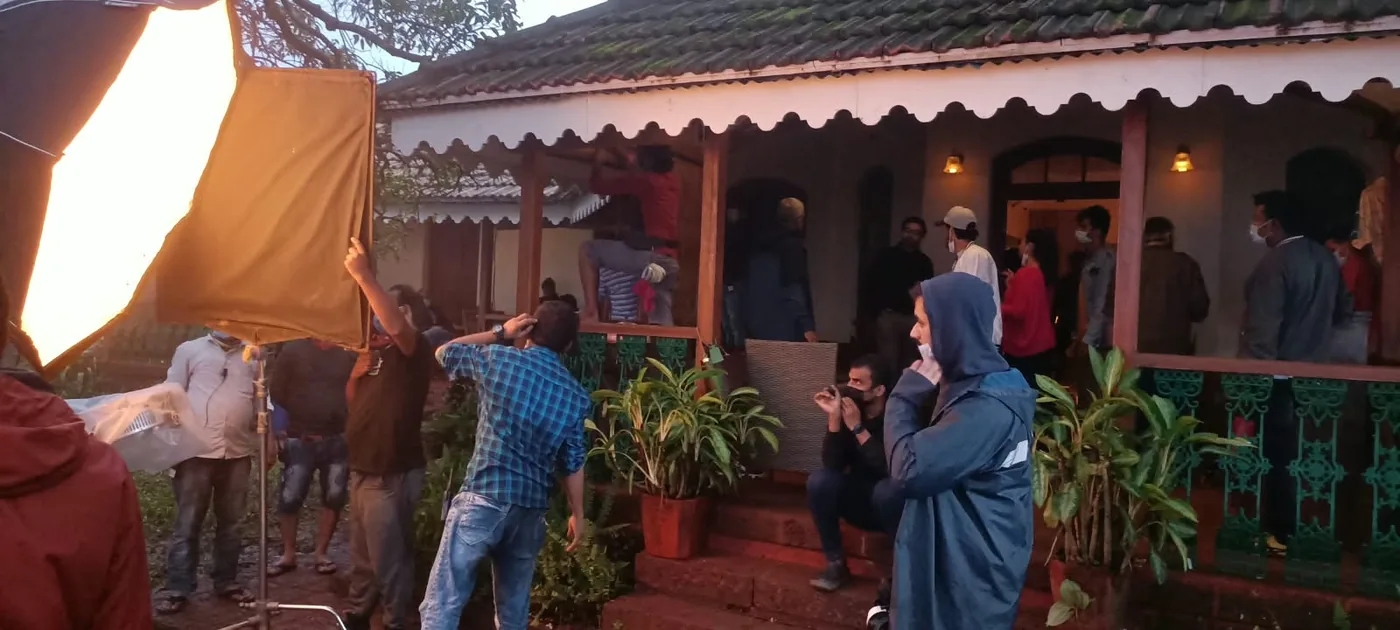 Unit moving into a bungalow set as dusk falls, power and lighting staged